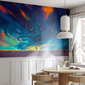 Fotomural Premium Sand - Una figura con globos frente a un cielo arremolinado lleno de colores. - 100x70cm - En un viento azul - Decoración de pared moderna para salón y dormitorio ARTTOR
