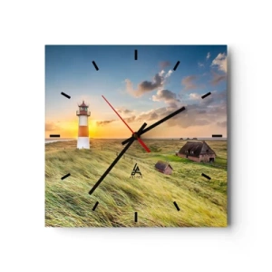 Reloj de pared - Reloj de vidrio - Un faro con prados y casas al sol al fondo. - 30x30cm - Entre las olas - Decoración de pared moderna para salón y dormitorio ARTTOR
