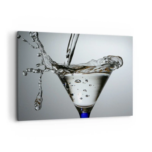 Cuadro sobre lienzo - Impresión de Imagen - Copa de Martini con salpicaduras de agua dinámicas sobre un fondo claro. - 120x80cm - Sobre el borde de una taza - Decoración de pared moderna para salón y dormitorio ARTTOR