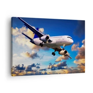 Cuadro sobre lienzo - Impresión de Imagen - Un avión de pasajeros contra las nubes al atardecer. - 70x50cm - Un viaje en blanco y azul - Decoración de pared moderna para salón y dormitorio ARTTOR