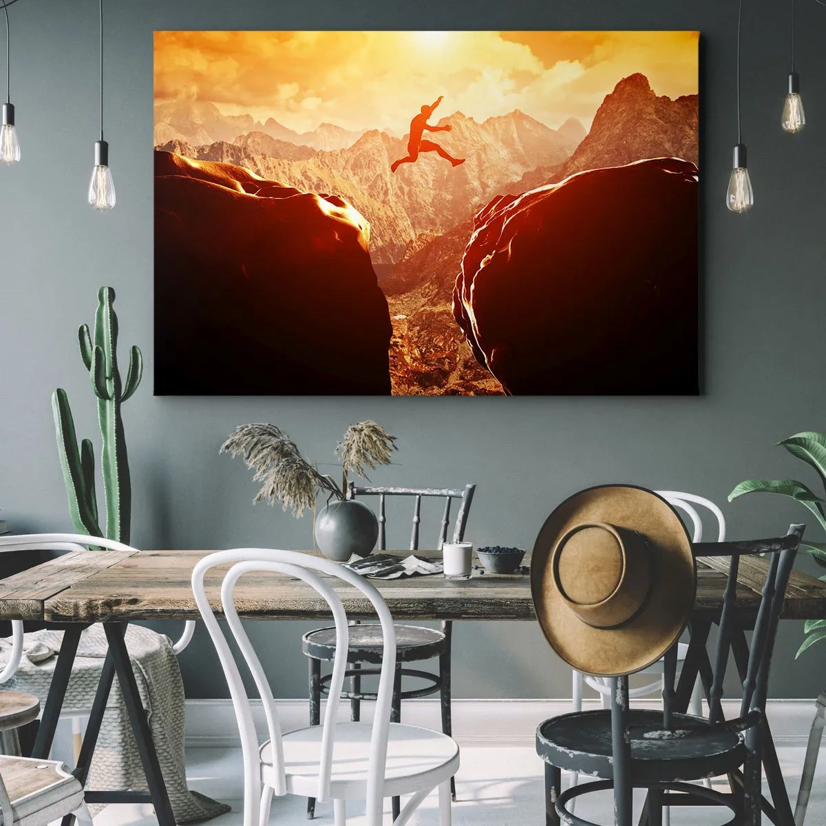 Cuadro sobre lienzo - Impresión de Imagen - Una figura saltando entre rocas con montañas al fondo. - 120x80cm - Pasando el límite - Decoración de pared moderna para salón y dormitorio ARTTOR