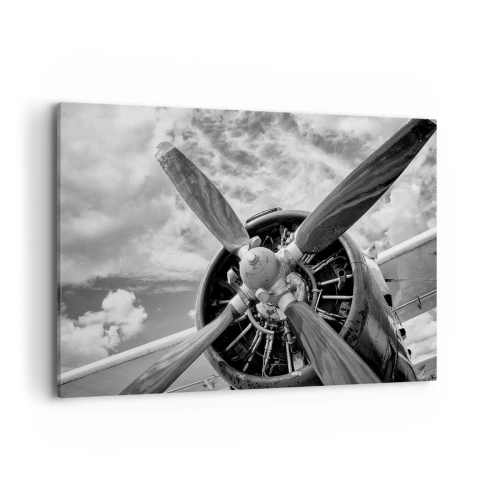 Cuadro sobre lienzo - Impresión de Imagen - Una fotografía en blanco y negro de la hélice de un avión contra un cielo dinámico. - 100x70cm - Conquistador de los cielos - Decoración de pared moderna para salón y dormitorio ARTTOR