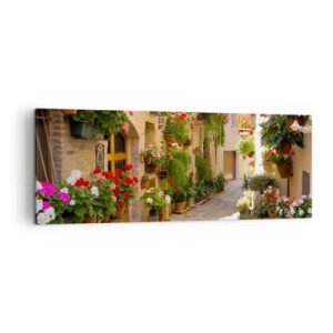 Cuadro sobre lienzo - Impresión de Imagen - Una calle con flores en macetas y muros de piedra. - 140x50cm - En un torrente de flores - Decoración de pared moderna para salón y dormitorio ARTTOR