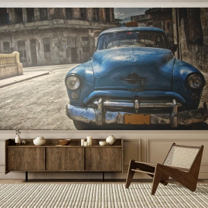 Fotomural Premium Sand - Un viejo coche azul con el telón de fondo de una calle histórica. - 100x70cm - Lo antiguo es hermoso - Decoración de pared moderna para salón y dormitorio ARTTOR
