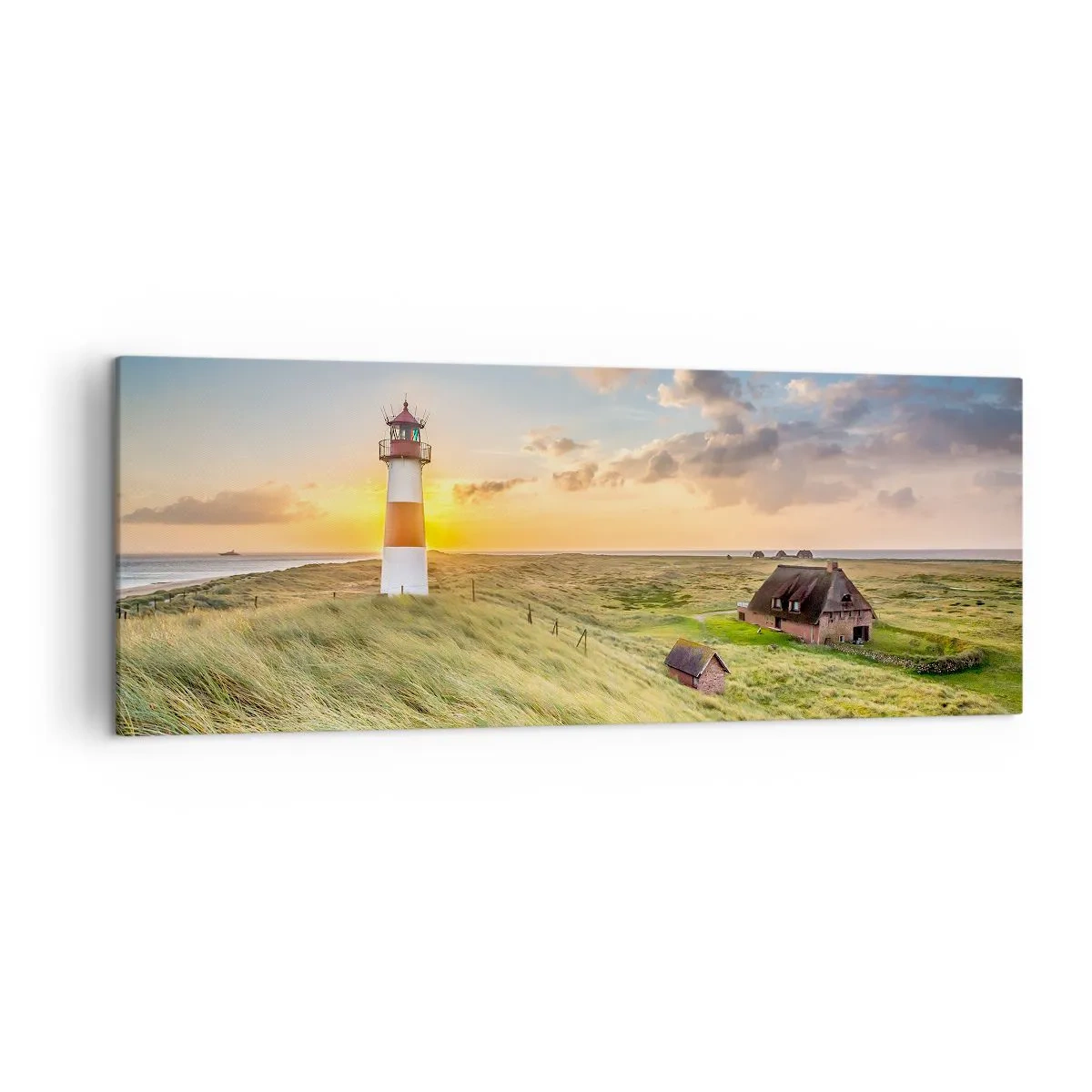 Cuadro sobre lienzo - Impresión de Imagen - Un faro con prados y casas al sol al fondo. - 140x50cm - Entre las olas - Decoración de pared moderna para salón y dormitorio ARTTOR