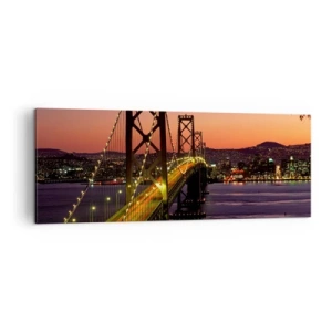 Cuadro sobre lienzo - Impresión de Imagen - Un puente iluminado por la noche sobre el agua con una vista panorámica de la ciudad. - 140x50cm - Tarde violeta - Decoración de pared moderna para salón y dormitorio ARTTOR