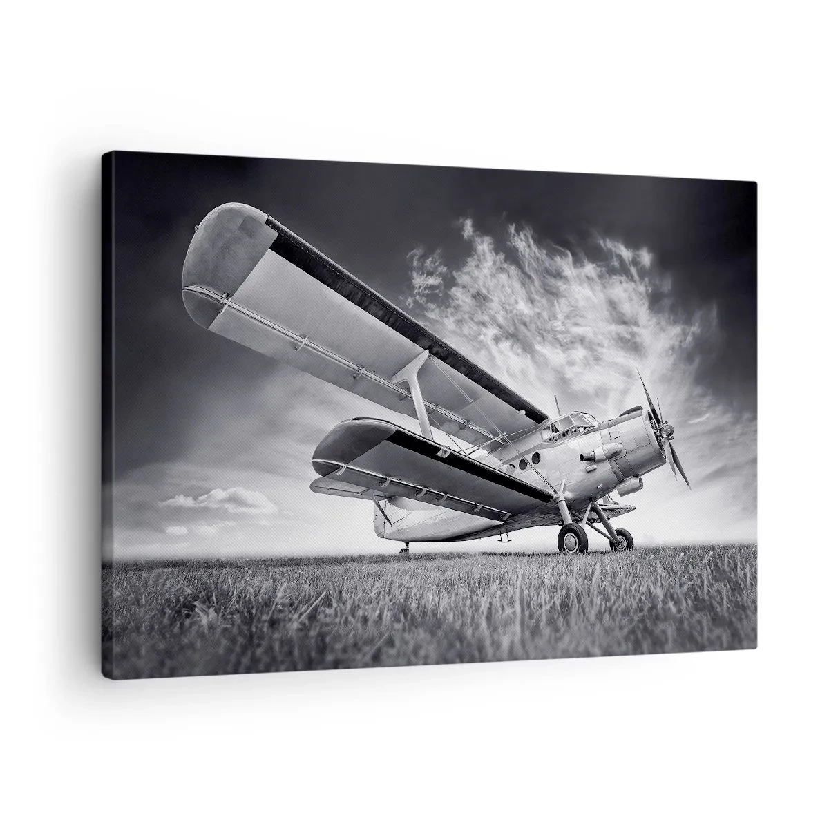 Cuadro sobre lienzo - Impresión de Imagen - Un avión contra un cielo dramático en blanco y negro. - 70x50cm - El vagamundo alado - Decoración de pared moderna para salón y dormitorio ARTTOR
