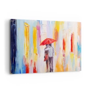 Cuadro sobre lienzo - Impresión de Imagen - Una pareja bajo un paraguas rojo con edificios coloridos al fondo. - 100x70cm - Que siga lloviendo - Decoración de pared moderna para salón y dormitorio ARTTOR