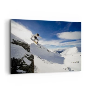 Cuadro sobre lienzo - Impresión de Imagen - Un snowboarder salta desde un acantilado con montañas cubiertas de nieve al fondo. - 100x70cm - Libertad sin fronteras - Decoración de pared moderna para salón y dormitorio ARTTOR