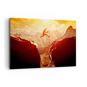 Cuadro sobre lienzo - Impresión de Imagen - Una figura saltando entre rocas con montañas al fondo. - 100x70cm - Pasando el límite - Decoración de pared moderna para salón y dormitorio ARTTOR