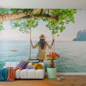 Fotomural Premium Canvas - Mujer en un columpio junto al mar en un paisaje tropical - 100x70cm - La vida es bella - Decoración de pared moderna para salón y dormitorio ARTTOR