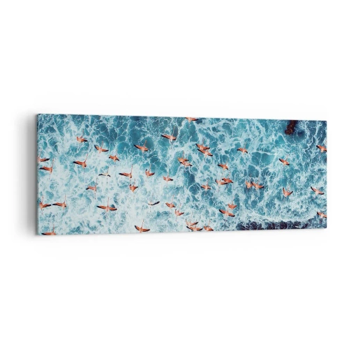 Cuadro sobre lienzo - Impresión de Imagen - Una vista aérea de flamencos rosados sobre un océano azul. - 140x50cm - Un desfile marítimo - Decoración de pared moderna para salón y dormitorio ARTTOR