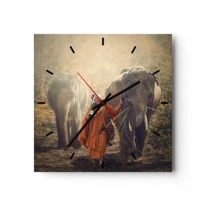 Reloj de pared - Reloj de vidrio - Un monje con una túnica naranja guía un elefante en el bosque. - 30x30cm - Comprensión total - Decoración de pared moderna para salón y dormitorio ARTTOR