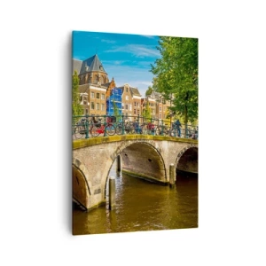 Cuadro sobre lienzo - Impresión de Imagen - Un pintoresco canal con un puente en Ámsterdam. - 70x100cm - Primavera en el canal - Decoración de pared moderna para salón y dormitorio ARTTOR