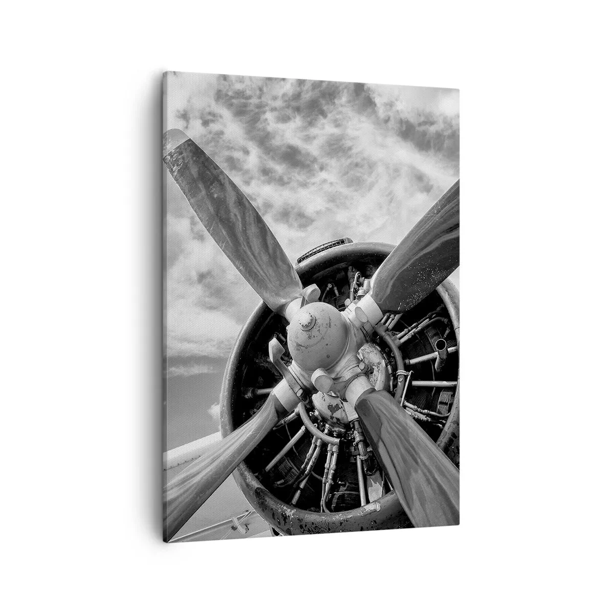 Cuadro sobre lienzo - Impresión de Imagen - Una fotografía en blanco y negro de la hélice de un avión contra un cielo dinámico. - 50x70cm - Conquistador de los cielos - Decoración de pared moderna para salón y dormitorio ARTTOR