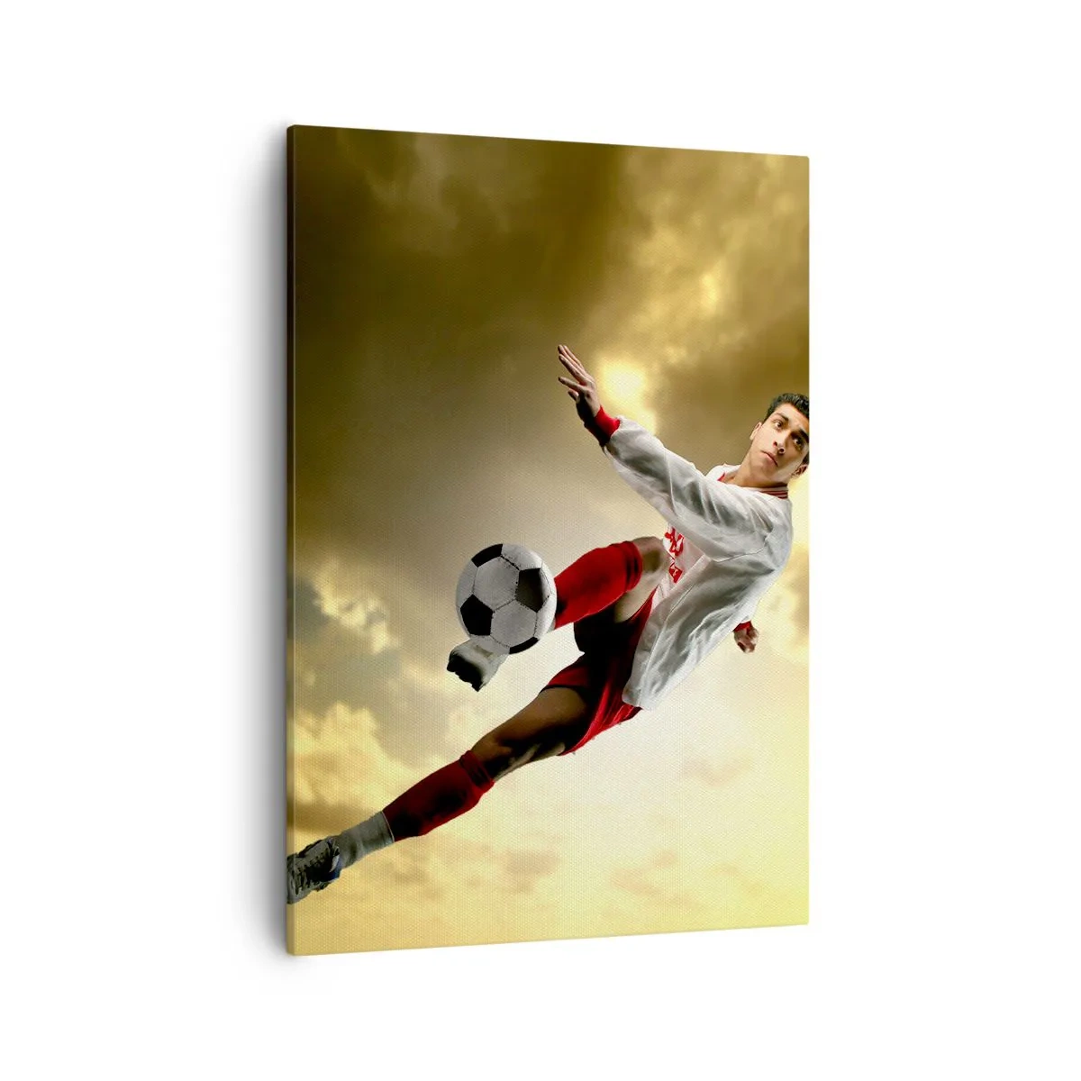 Cuadro sobre lienzo - Impresión de Imagen - Un jugador de fútbol en un salto dinámico pateando el balón contra el cielo. - 50x70cm - El cielo del fútbol - Decoración de pared moderna para salón y dormitorio ARTTOR