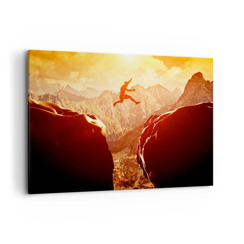 Cuadro sobre lienzo - Impresión de Imagen - Una figura saltando entre rocas con montañas al fondo. - 100x70cm - Pasando el límite - Decoración de pared moderna para salón y dormitorio ARTTOR