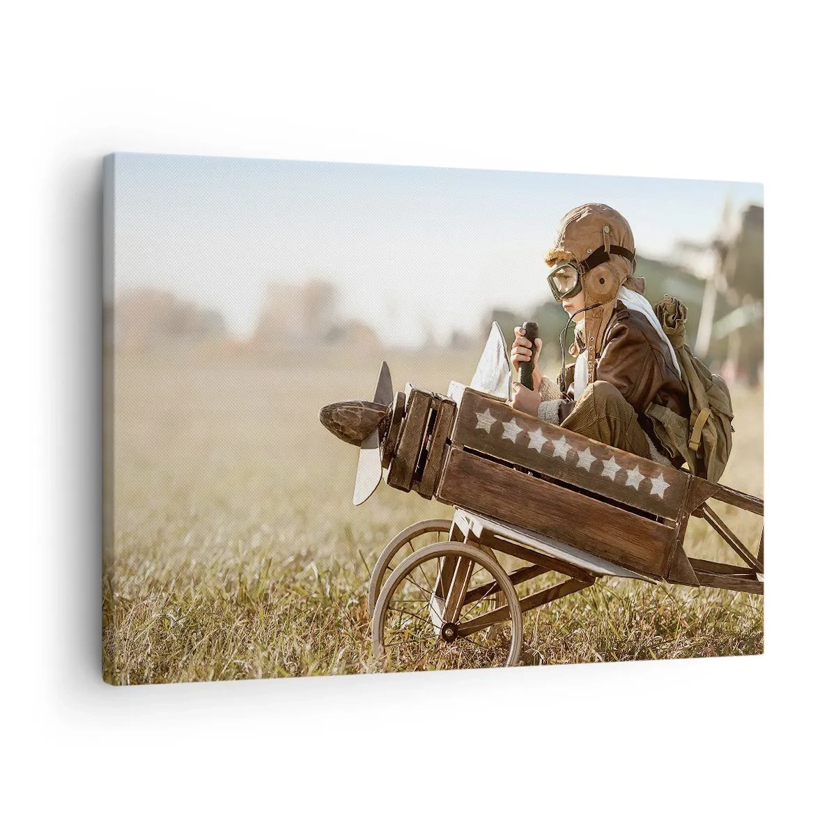 Cuadro sobre lienzo - Impresión de Imagen - Un niño en un avión de juguete con un campo al fondo. - 70x50cm - Despegue hacia un sueño - Decoración de pared moderna para salón y dormitorio ARTTOR