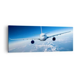 Cuadro sobre lienzo - Impresión de Imagen - Un avión volando sobre las nubes contra un cielo azul. - 140x50cm - Vuelo porque quiero - Decoración de pared moderna para salón y dormitorio ARTTOR