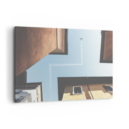 Cuadro sobre lienzo - Impresión de Imagen - Vista del avión y su estela en el cielo desde una perspectiva callejera. - 100x70cm - Por encima del laberinto urbano - Decoración de pared moderna para salón y dormitorio ARTTOR