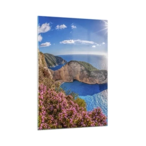 Cuadro sobre vidrio - Impresiones sobre Vidrio - Un acantilado con flores, un mar turquesa y un soleado paisaje griego. - 70x100cm - Mis grandes vacaciones en Grecia - Decoración de pared moderna para salón y dormitorio ARTTOR