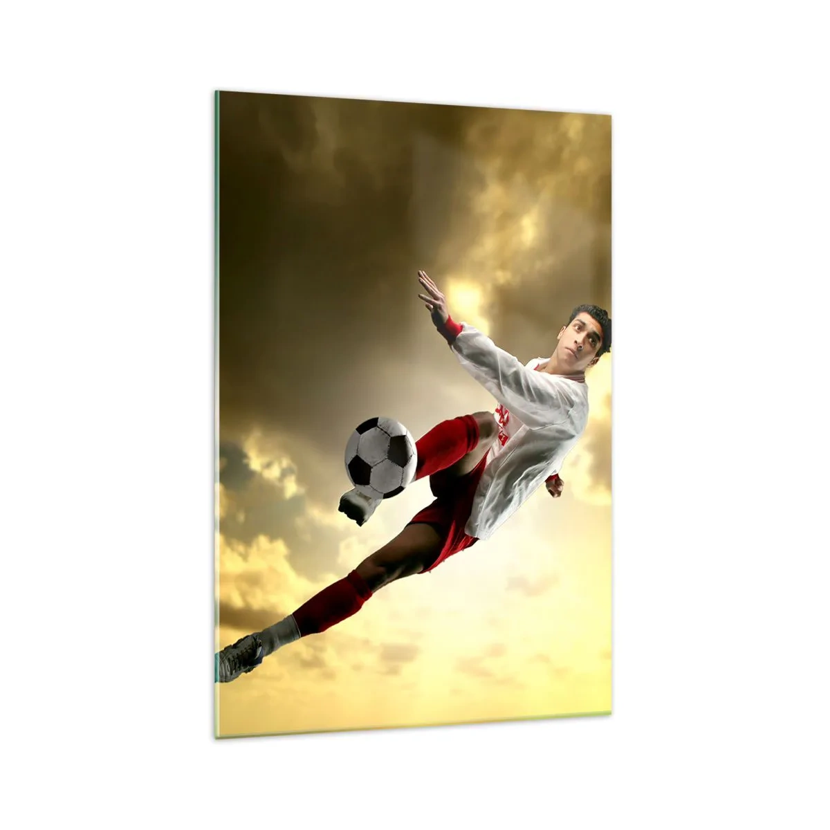 Cuadro sobre vidrio - Impresiones sobre Vidrio - Un jugador de fútbol en un salto dinámico pateando el balón contra el cielo. - 70x100cm - El cielo del fútbol - Decoración de pared moderna para salón y dormitorio ARTTOR