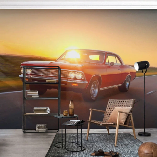 Fotomural Premium Canvas - Un coche rojo al atardecer en una carretera abierta. - 100x70cm - El deseo es rojo - Decoración de pared moderna para salón y dormitorio ARTTOR