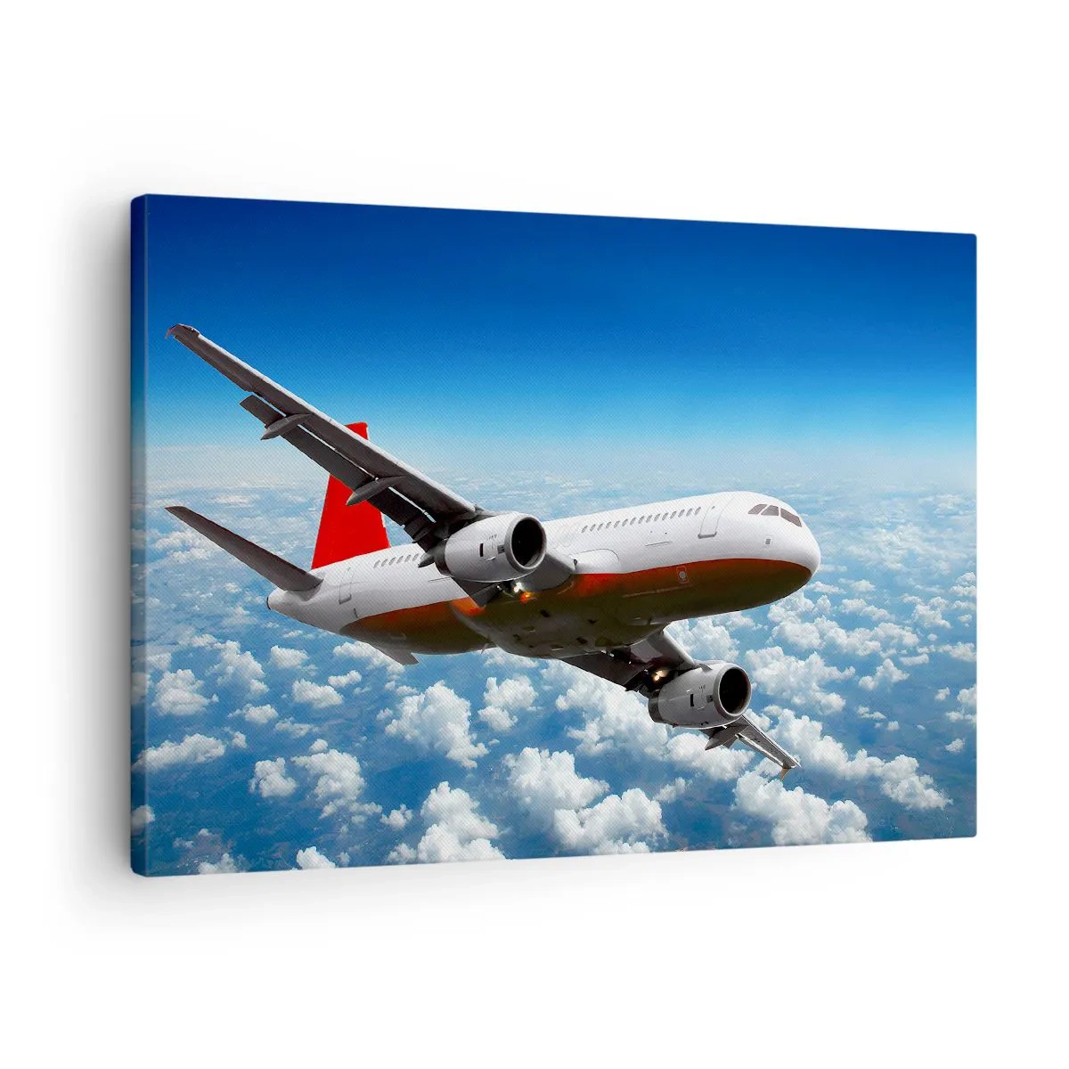 Cuadro sobre lienzo - Impresión de Imagen - Un avión de pasajeros volando sobre las nubes contra un cielo azul. - 70x50cm - Aléjese de todo - Decoración de pared moderna para salón y dormitorio ARTTOR