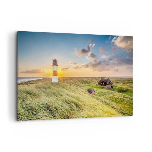 Cuadro sobre lienzo - Impresión de Imagen - Un faro con prados y casas al sol al fondo. - 120x80cm - Entre las olas - Decoración de pared moderna para salón y dormitorio ARTTOR