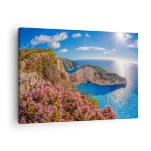 Cuadro sobre lienzo - Impresión de Imagen - Un acantilado con flores, un mar turquesa y un soleado paisaje griego. - 70x50cm - Mis grandes vacaciones en Grecia - Decoración de pared moderna para salón y dormitorio ARTTOR