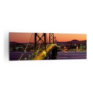 Cuadro sobre lienzo - Impresión de Imagen - Un puente iluminado por la noche sobre el agua con una vista panorámica de la ciudad. - 160x50cm - Tarde violeta - Decoración de pared moderna para salón y dormitorio ARTTOR