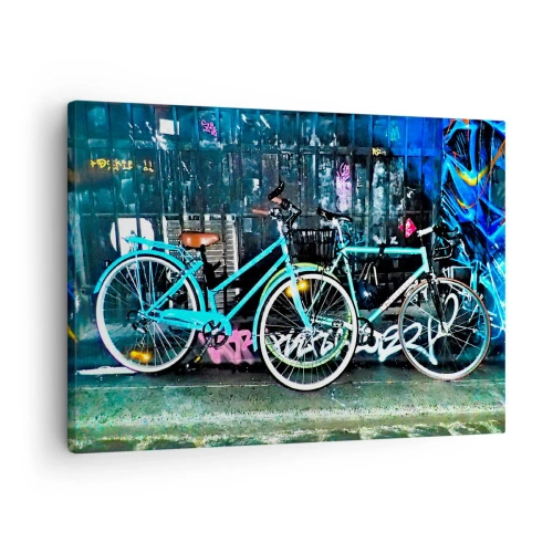 Cuadro sobre lienzo - Impresión de Imagen - Dos bicicletas turquesas sobre un fondo de grafiti urbano. - 70x50cm - La ciudad llama - Decoración de pared moderna para salón y dormitorio ARTTOR